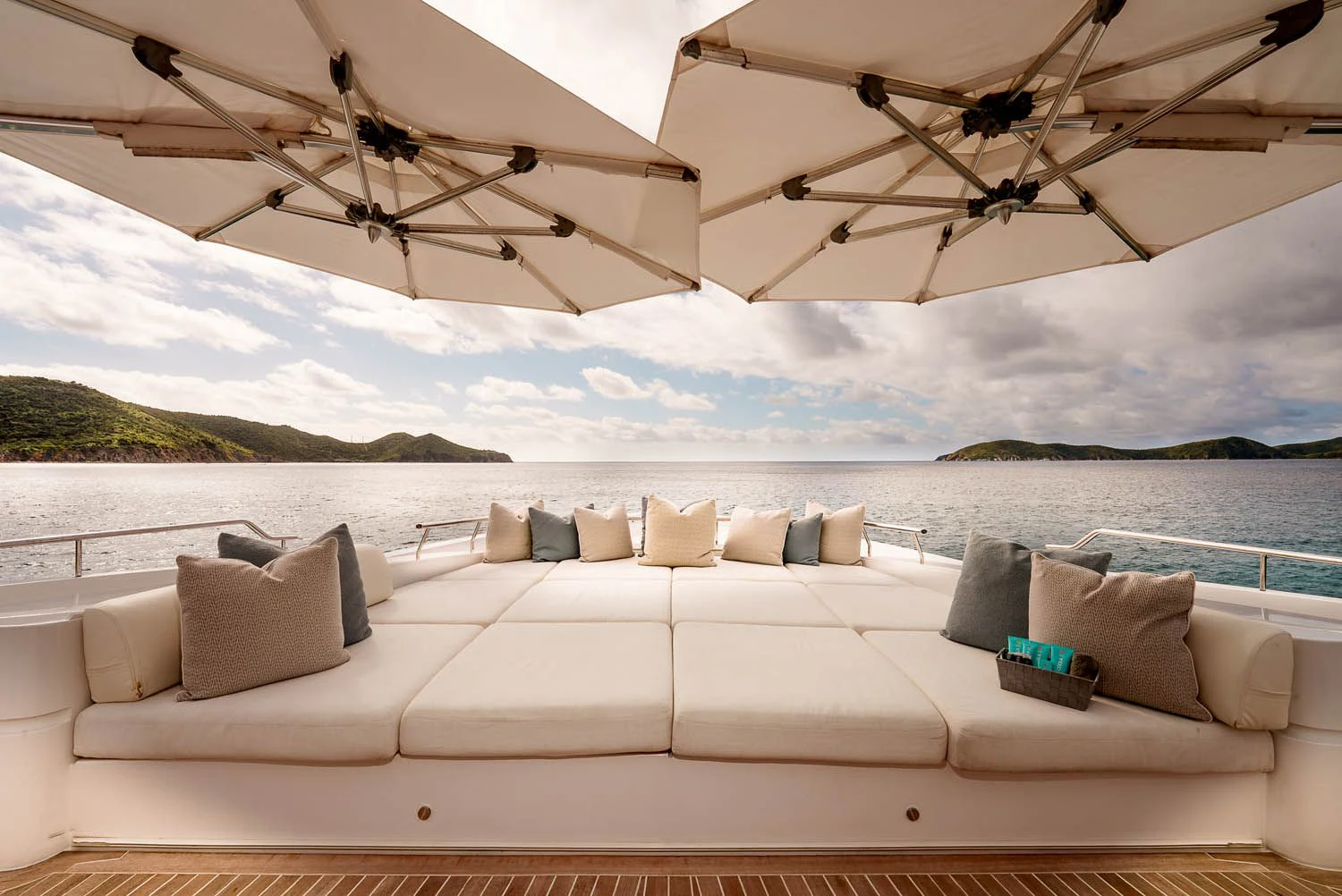 a white couch on a beach aboard KING BABY Yacht for Sale