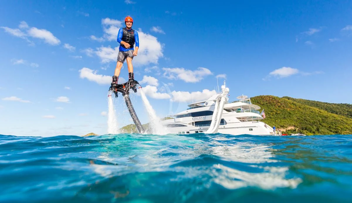 a man on a jet ski jumping into the water aboard KING BABY Yacht for Sale