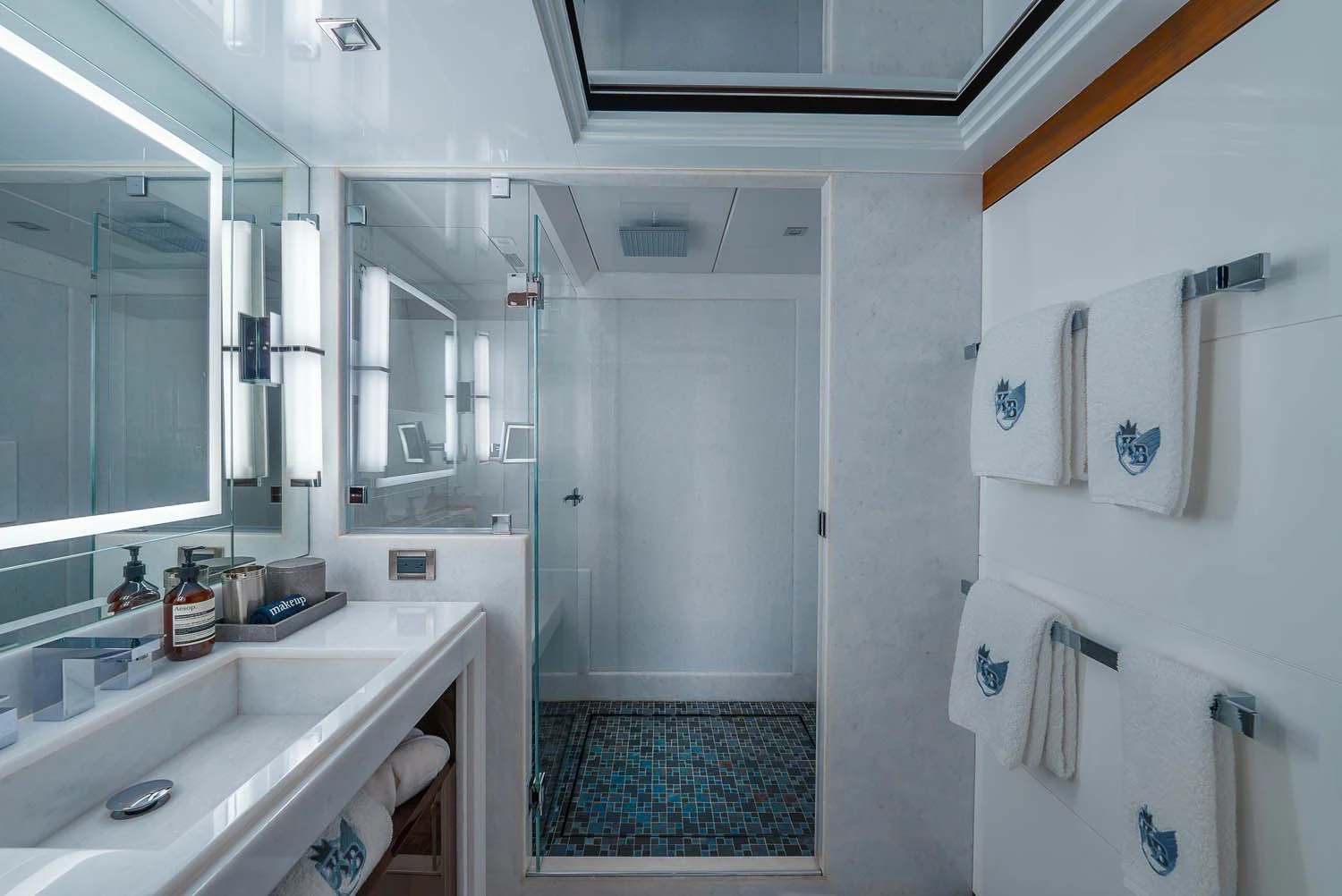 a bathroom with a sink and a mirror aboard KING BABY Yacht for Sale