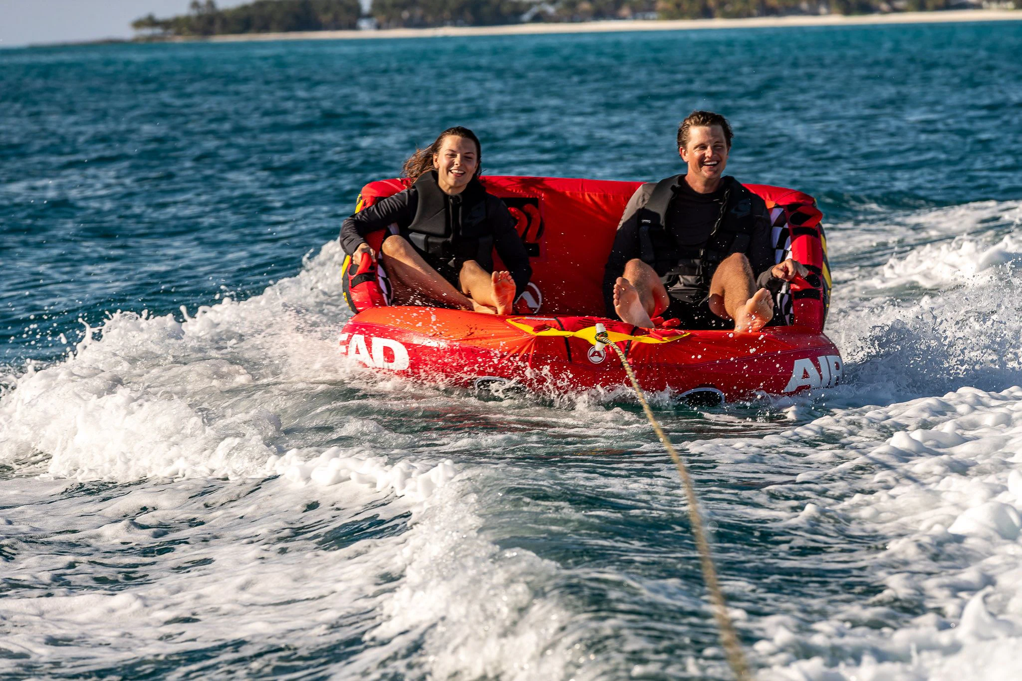 a couple of people on a raft in the water aboard KING BABY Yacht for Sale