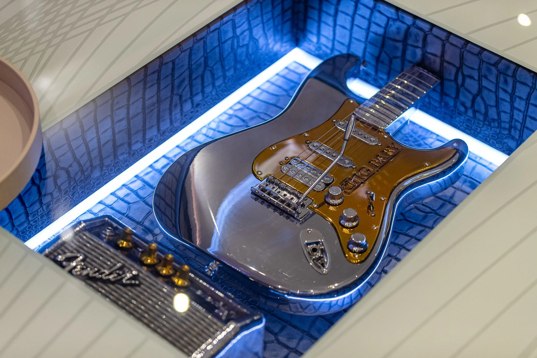 a close-up of a guitar aboard KING BABY Yacht for Sale