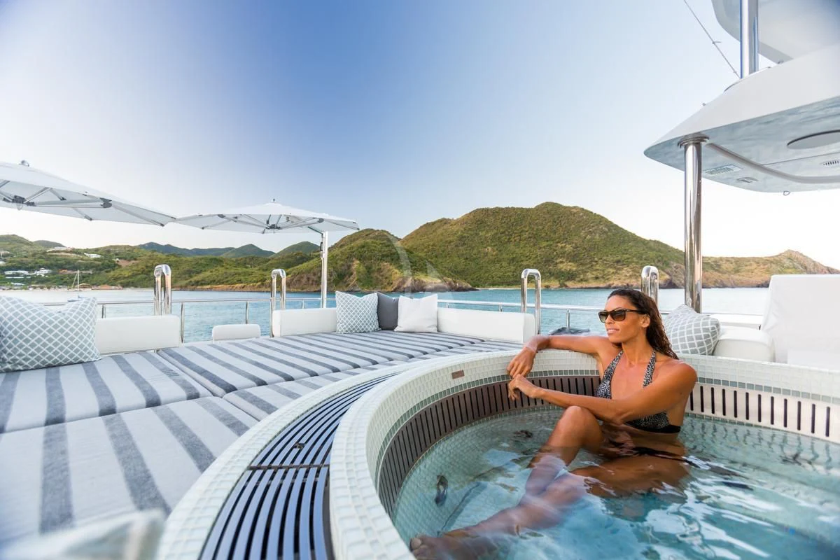 a woman sitting in a hot tub aboard KING BABY Yacht for Sale