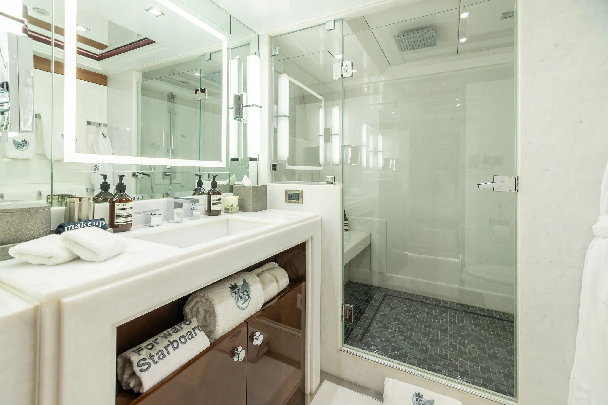 a bathroom with a large mirror aboard KING BABY Yacht for Sale