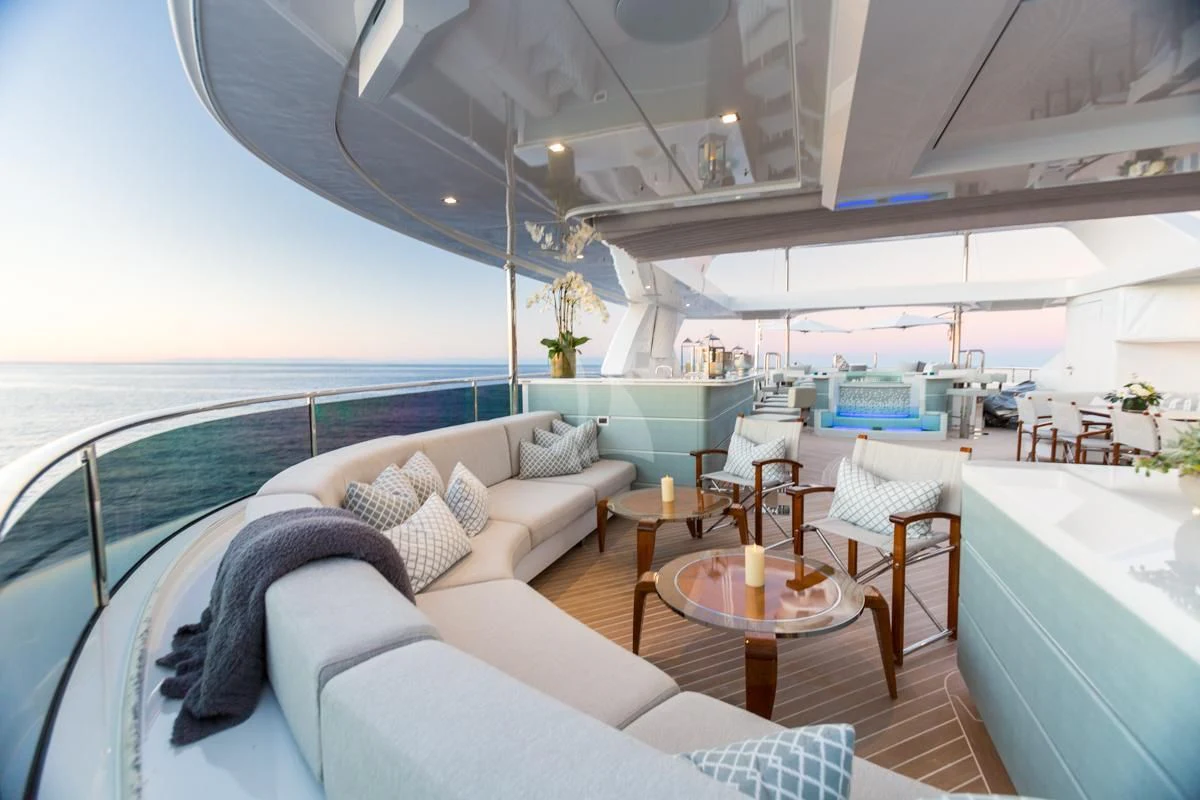 a room with a couch and a table and chairs aboard KING BABY Yacht for Sale