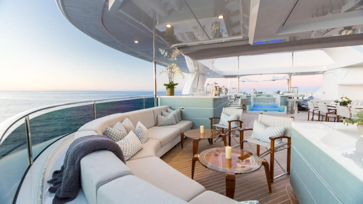 a room with a couch and a table and chairs aboard KING BABY Yacht for Sale