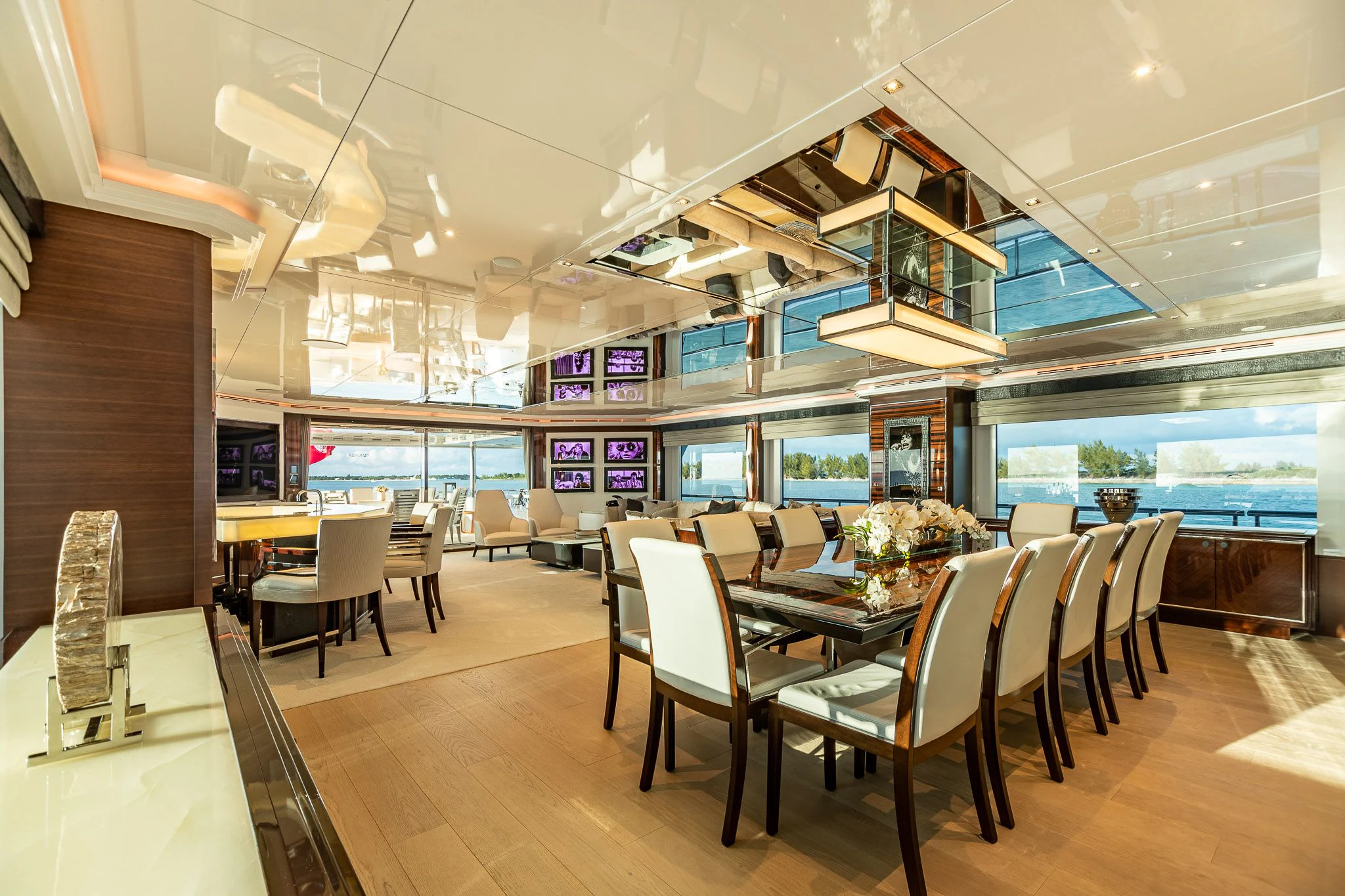 a room with tables and chairs aboard KING BABY Yacht for Sale