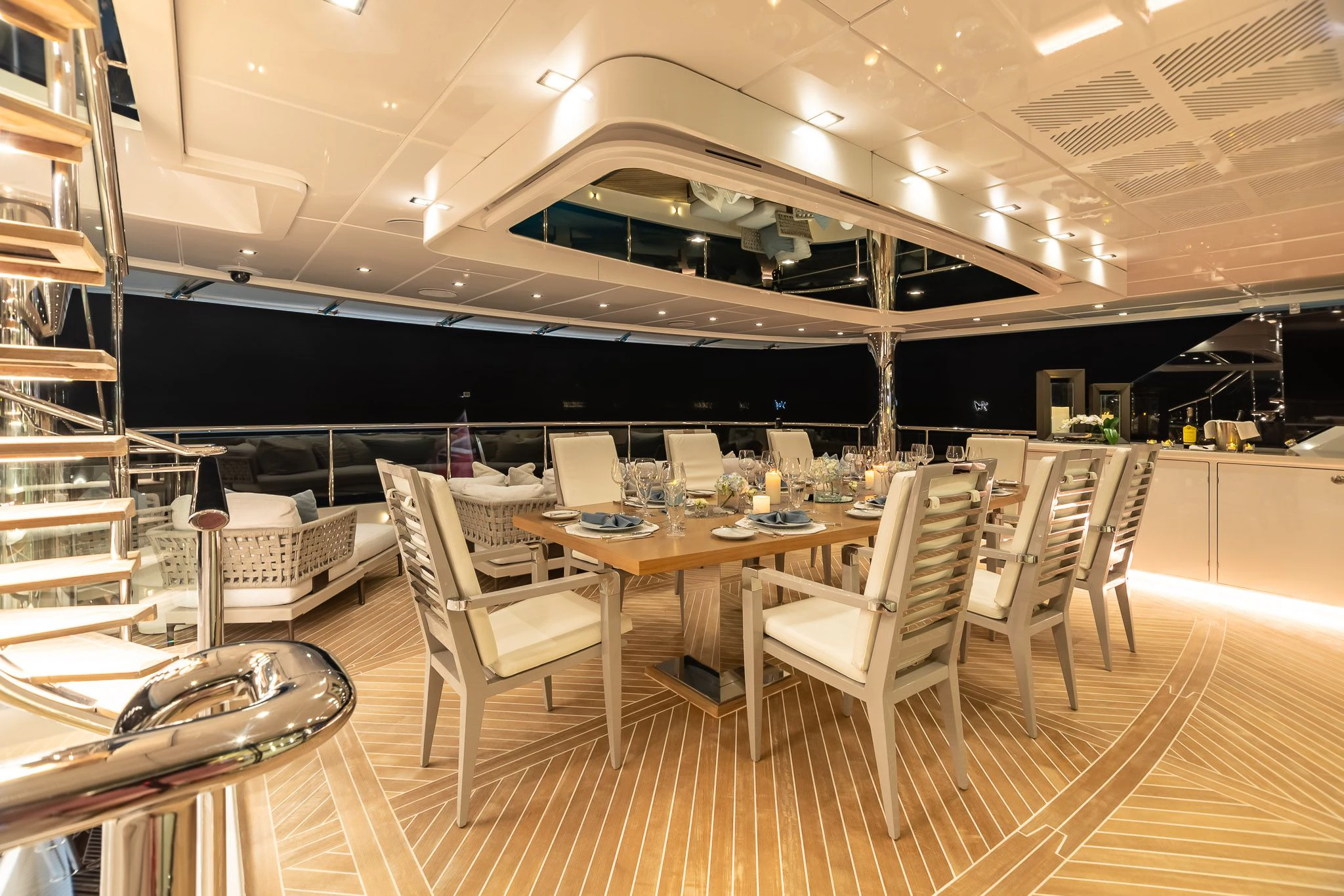 a room with tables and chairs aboard KING BABY Yacht for Sale