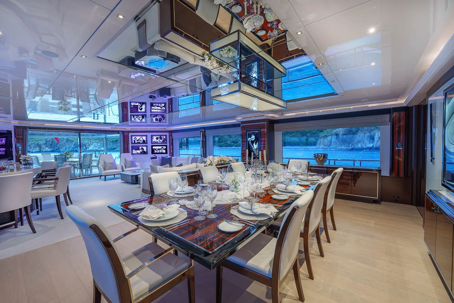 a large room with tables and chairs aboard KING BABY Yacht for Sale
