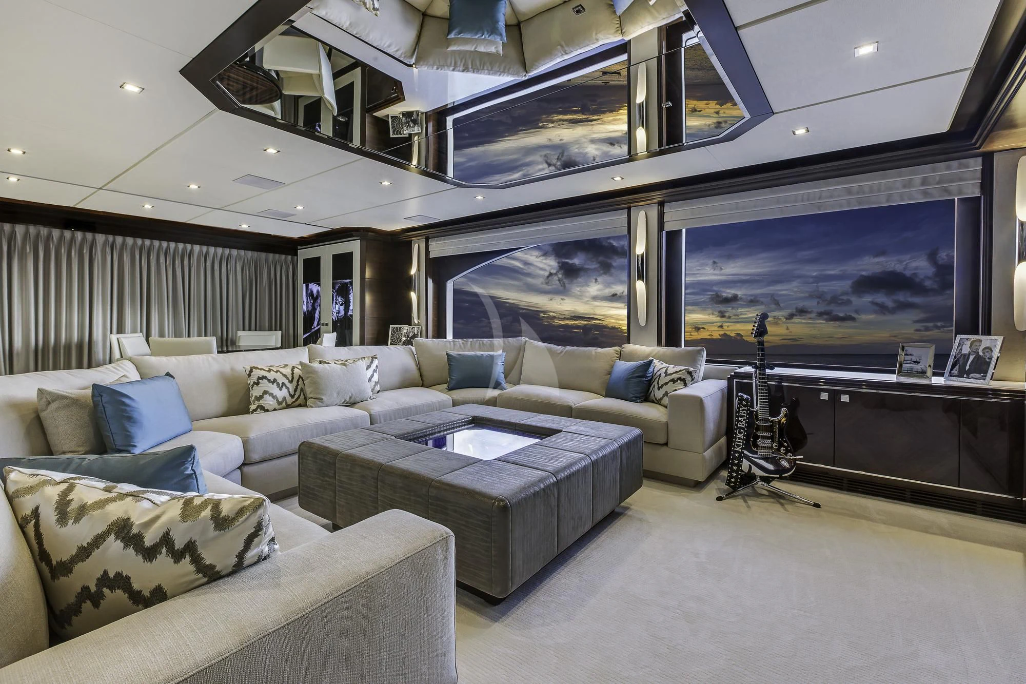 a living room with a large screen aboard KING BABY Yacht for Sale