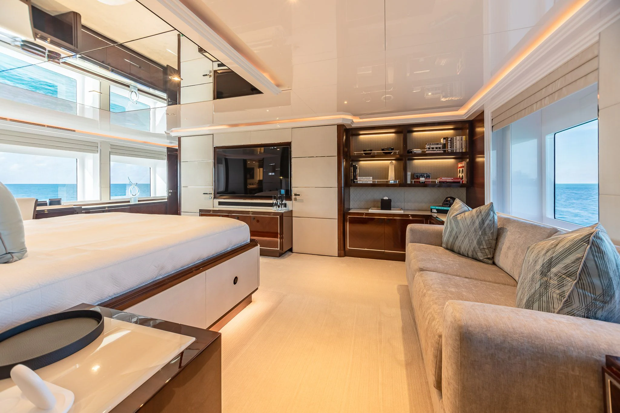 a bedroom with a bed and a couch aboard KING BABY Yacht for Sale
