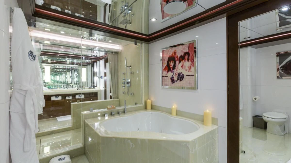 a bathroom with a sink and a mirror aboard KING BABY Yacht for Sale