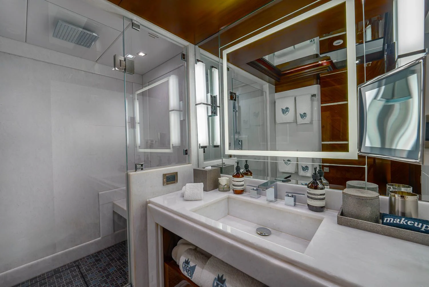 a bathroom with a large mirror aboard KING BABY Yacht for Sale