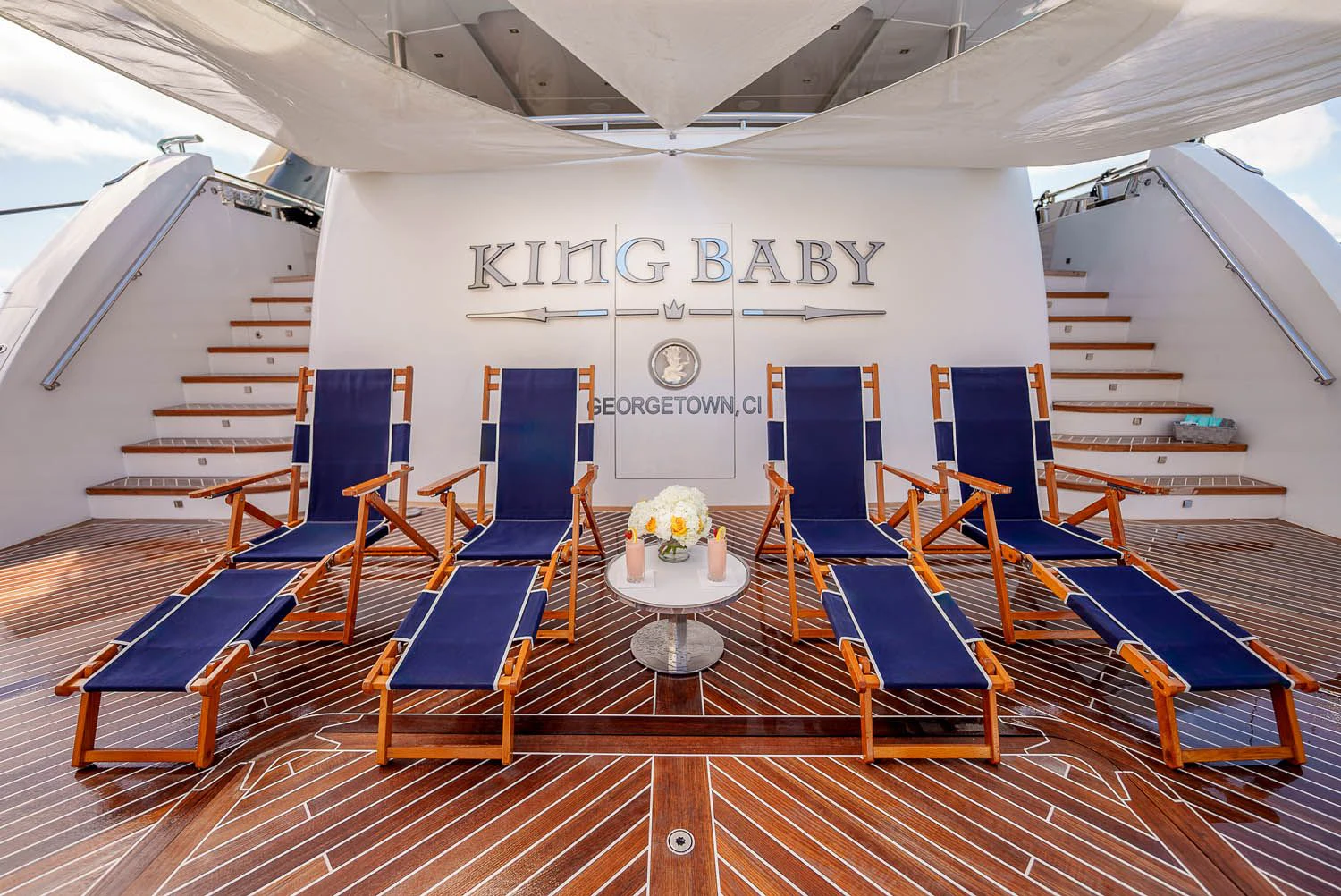 a room with chairs and a table aboard KING BABY Yacht for Sale