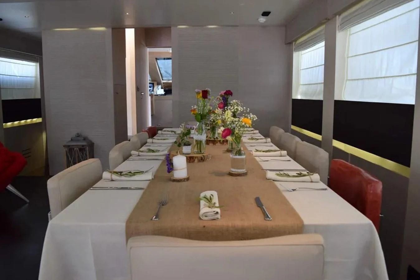 a dining room with a table and chairs aboard AURORA Yacht for Sale