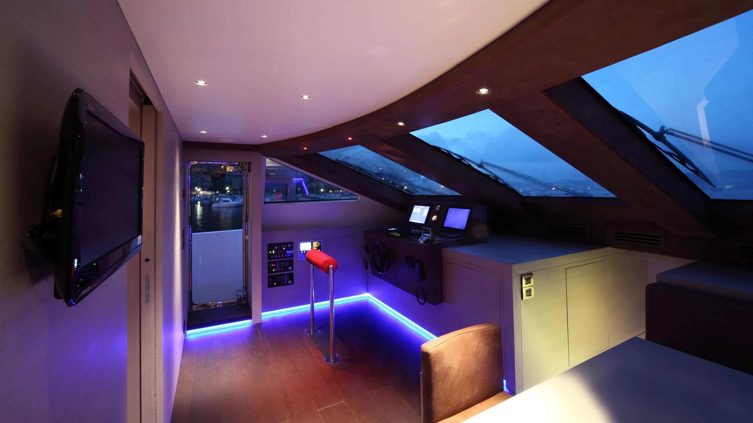 a room with a desk and a tv aboard AURORA Yacht for Sale