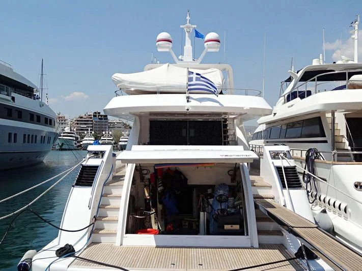 a boat with a flag on the front aboard AURORA Yacht for Sale