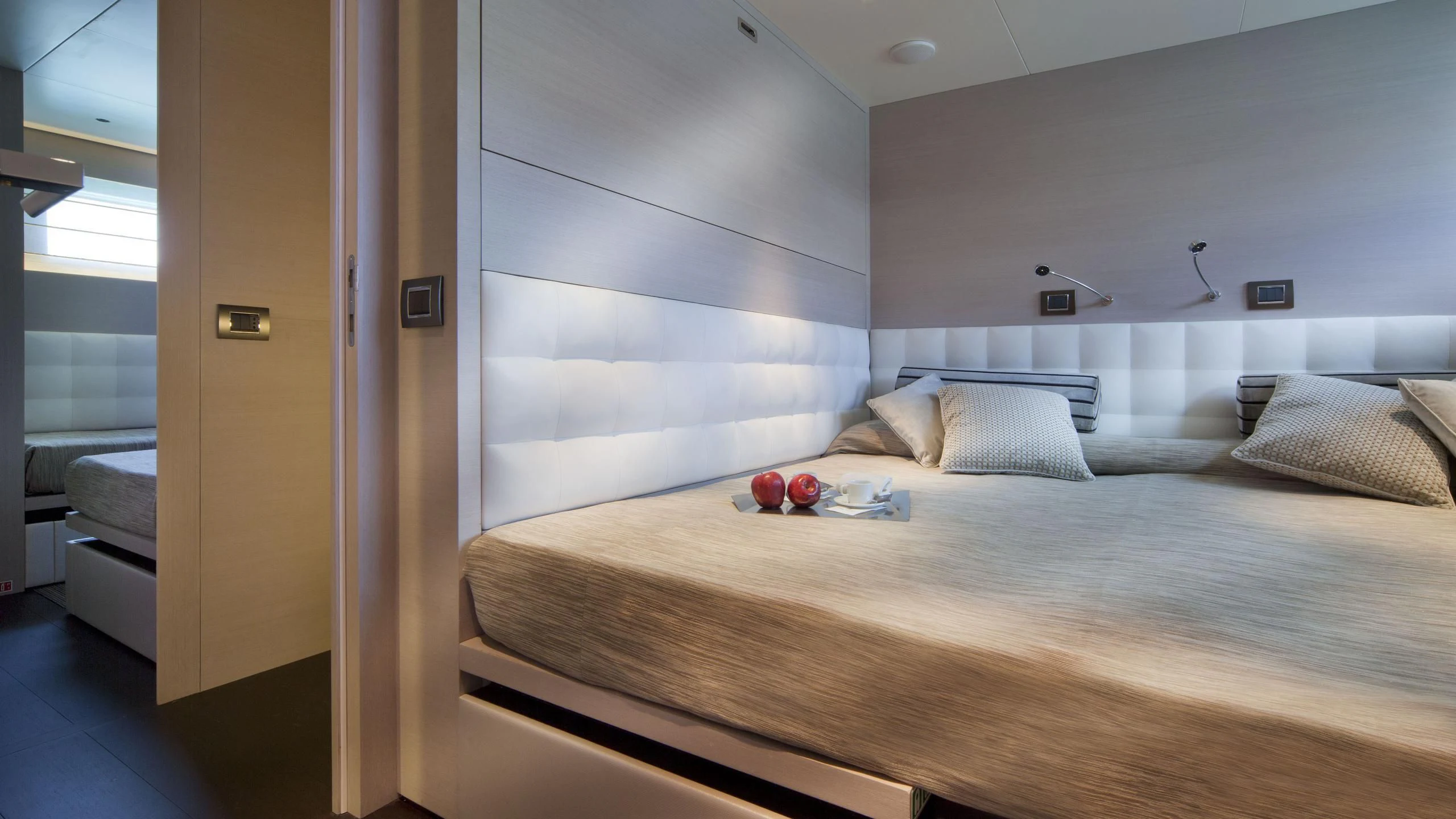a bed with a white sheet aboard AURORA Yacht for Sale