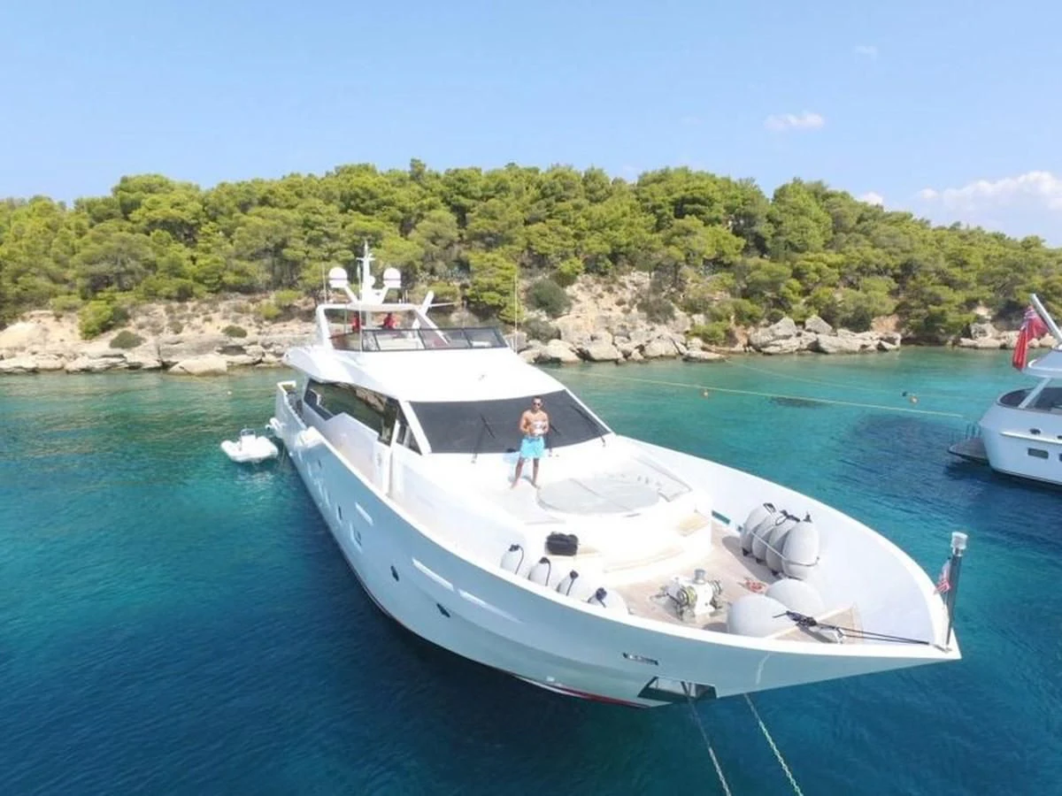 a person standing on a boat aboard AURORA Yacht for Sale