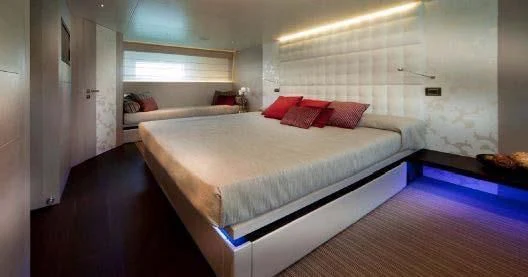 a room with two beds aboard AURORA Yacht for Sale