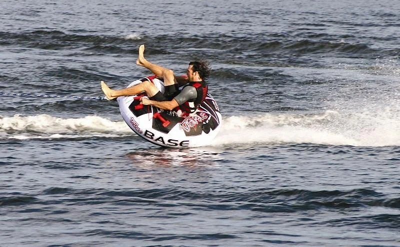 a man riding a jet ski aboard AURORA Yacht for Sale