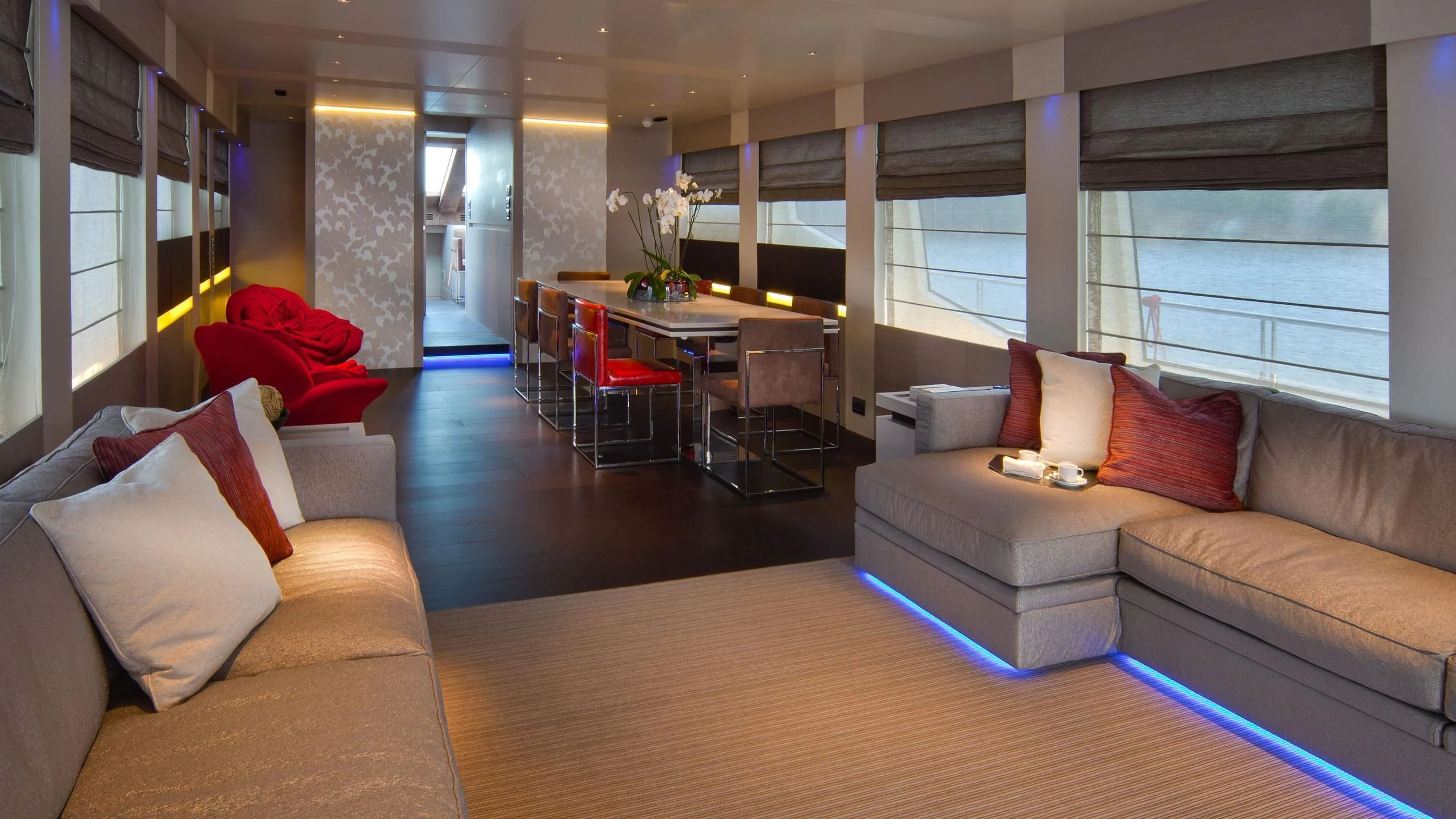 a living room with a couch and a table aboard AURORA Yacht for Sale