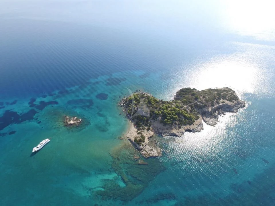 a body of water with land and land in the distance aboard AURORA Yacht for Sale