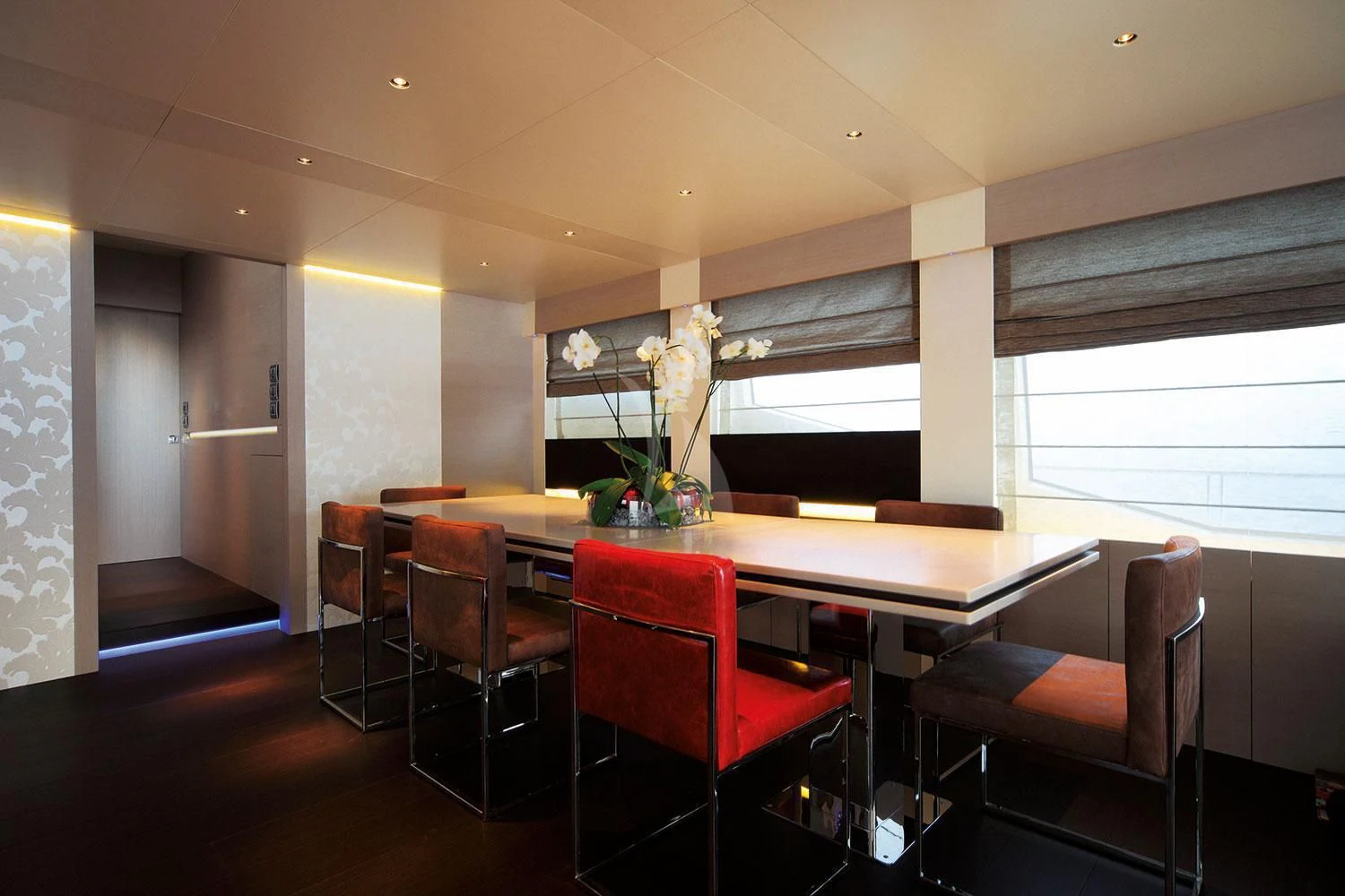 a room with a table and chairs aboard AURORA Yacht for Sale