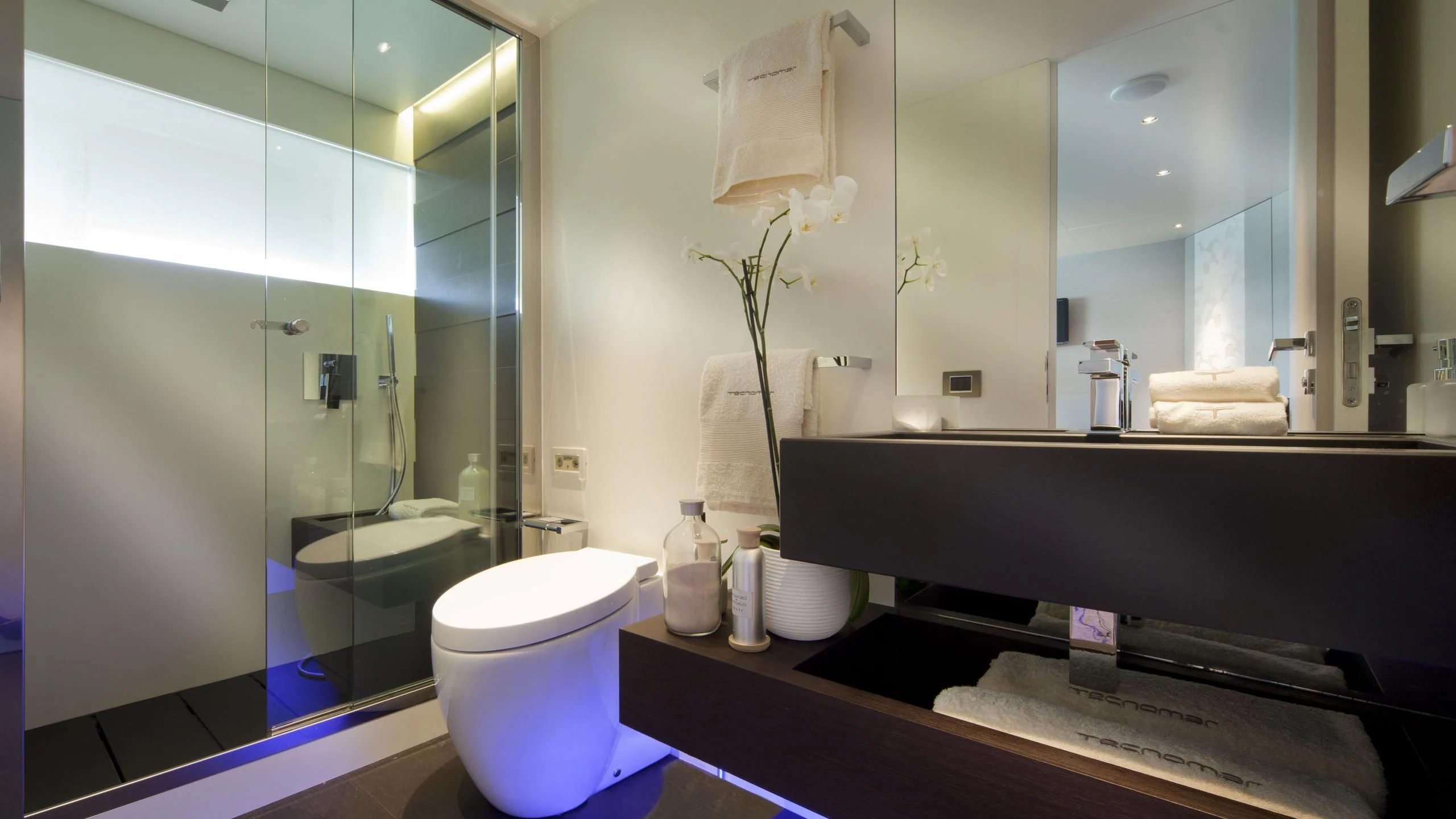 a bathroom with a glass shower aboard AURORA Yacht for Sale