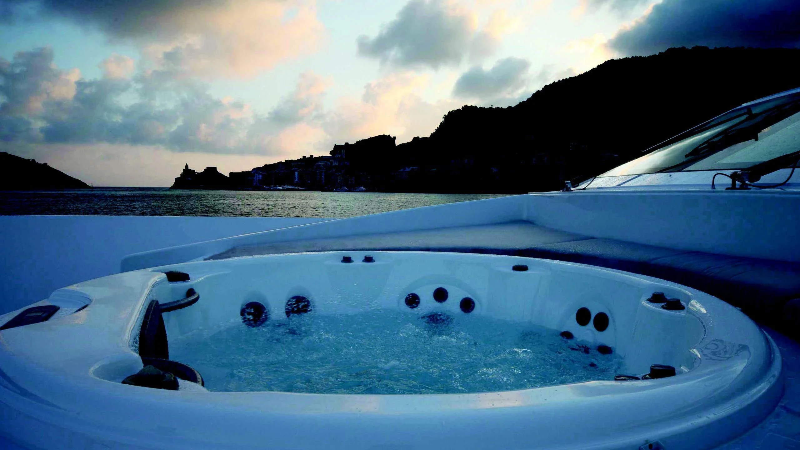 a white boat on water aboard AURORA Yacht for Sale