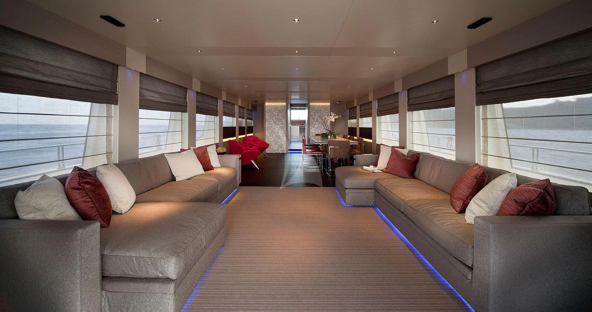 a living room with a couch and a table aboard AURORA Yacht for Sale