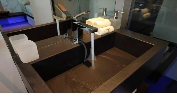 a bathroom with a countertop sink and mirror aboard AURORA Yacht for Sale