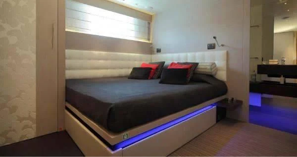 a bed in a room aboard AURORA Yacht for Sale