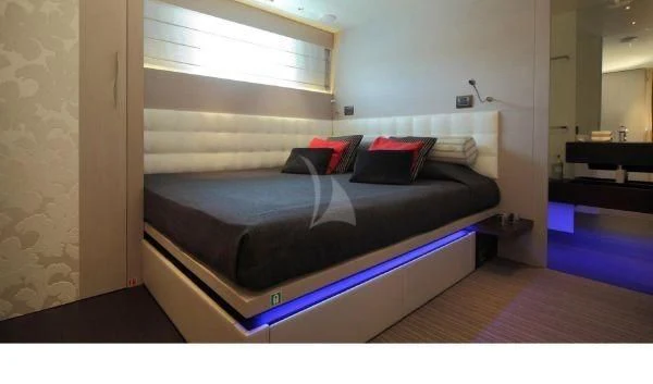 a bed in a room aboard AURORA Yacht for Sale