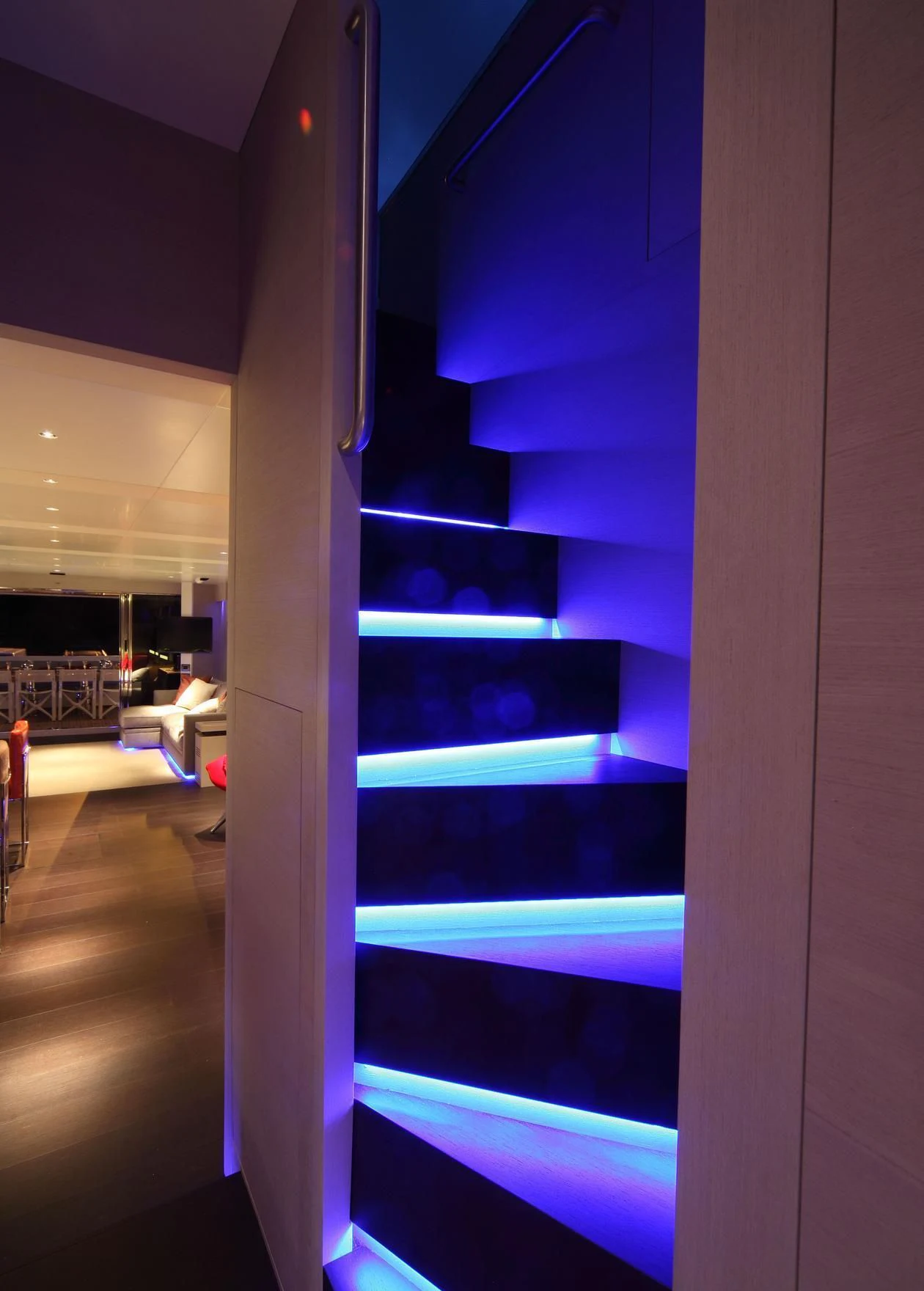 a room with a blue wall aboard AURORA Yacht for Sale