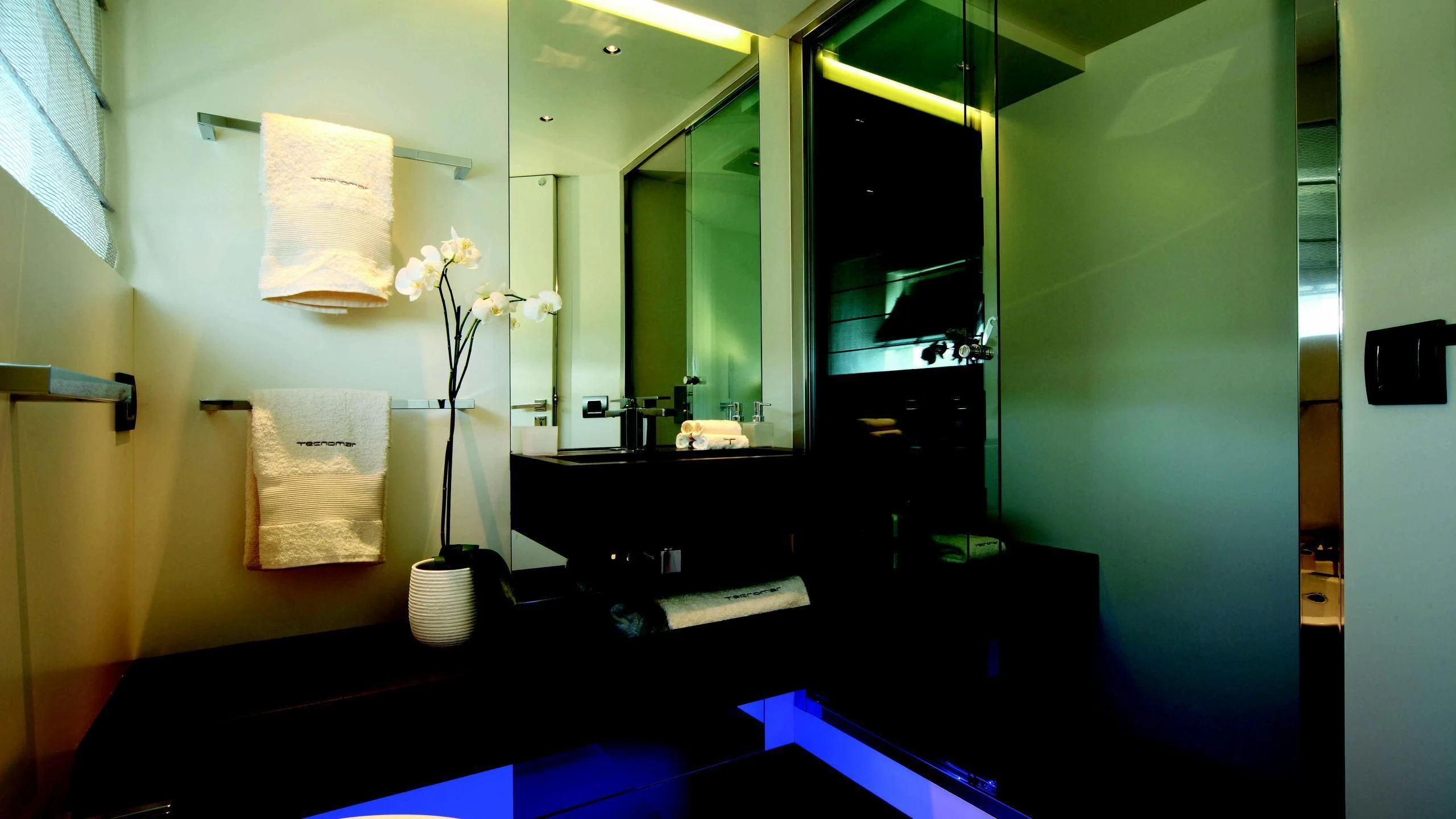 a bathroom with a vase of flowers aboard AURORA Yacht for Sale