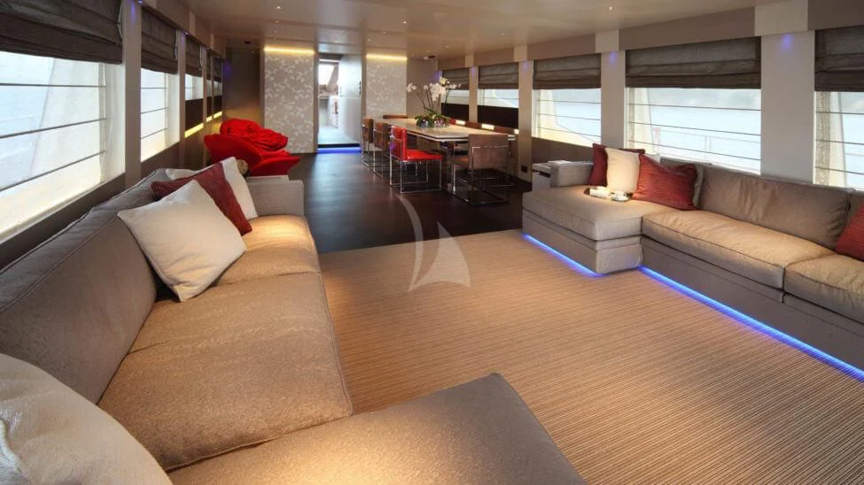 a living room with a couch and a table aboard AURORA Yacht for Sale