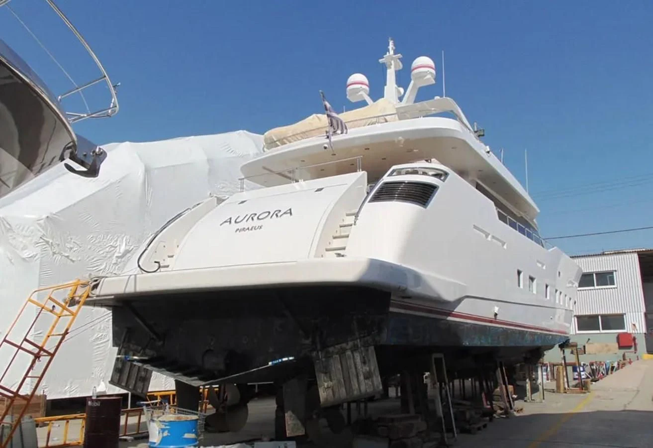 a large ship with a statue on top aboard AURORA Yacht for Sale