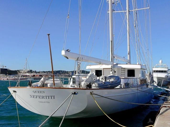 a boat docked at a pier aboard QUEEN NEFERTITI Yacht for Sale