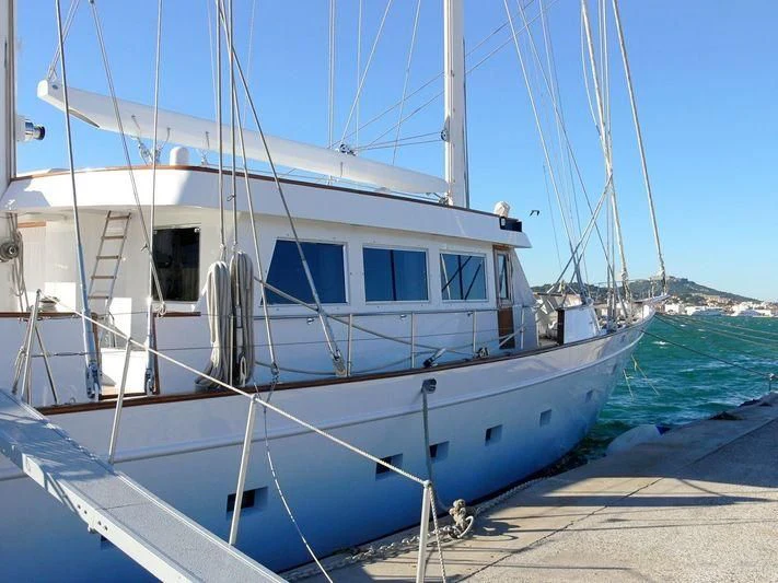 a white boat on a beach aboard QUEEN NEFERTITI Yacht for Sale