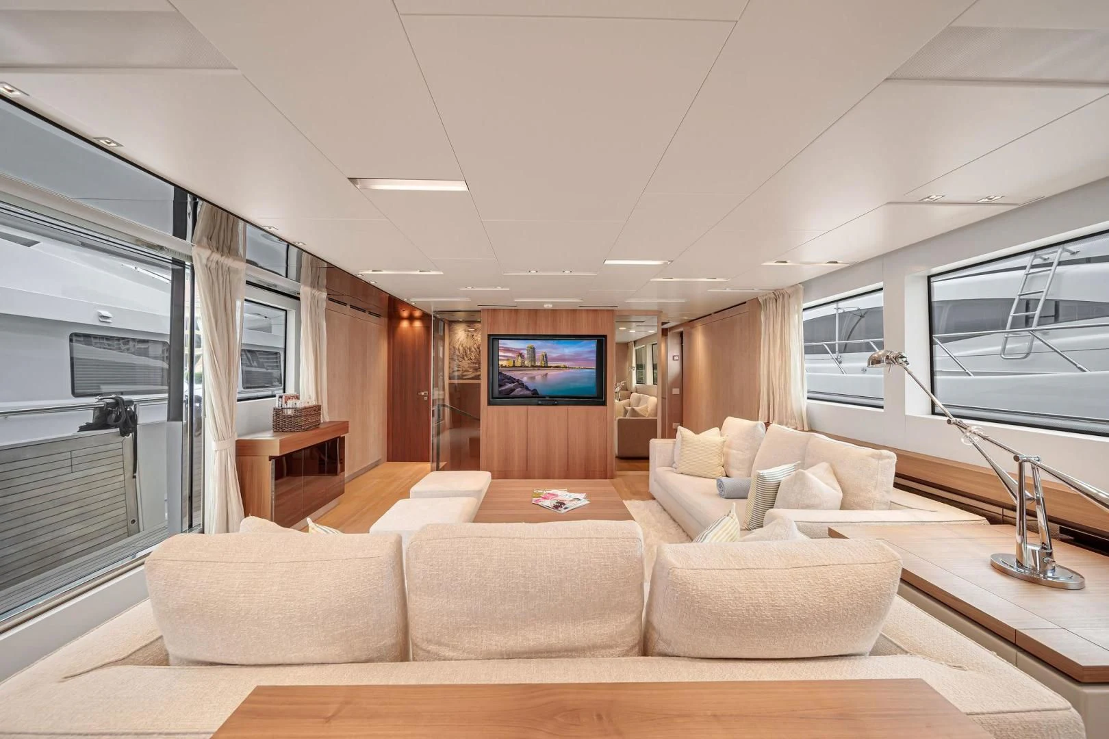 a living room with a large screen aboard PEACEKEEPER Yacht for Sale