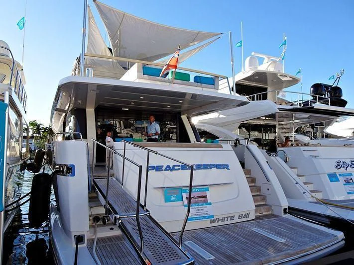 a boat with a white canopy aboard PEACEKEEPER Yacht for Sale