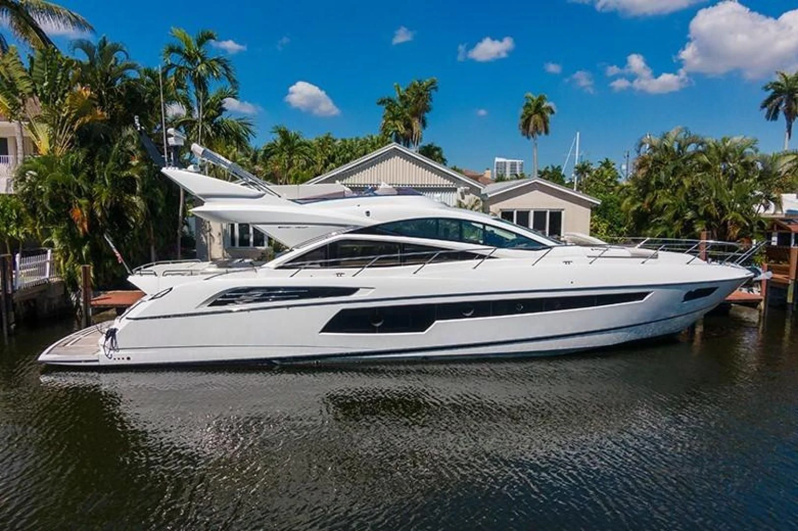 a white yacht in the water aboard LONG WAY ROUND Yacht for Sale