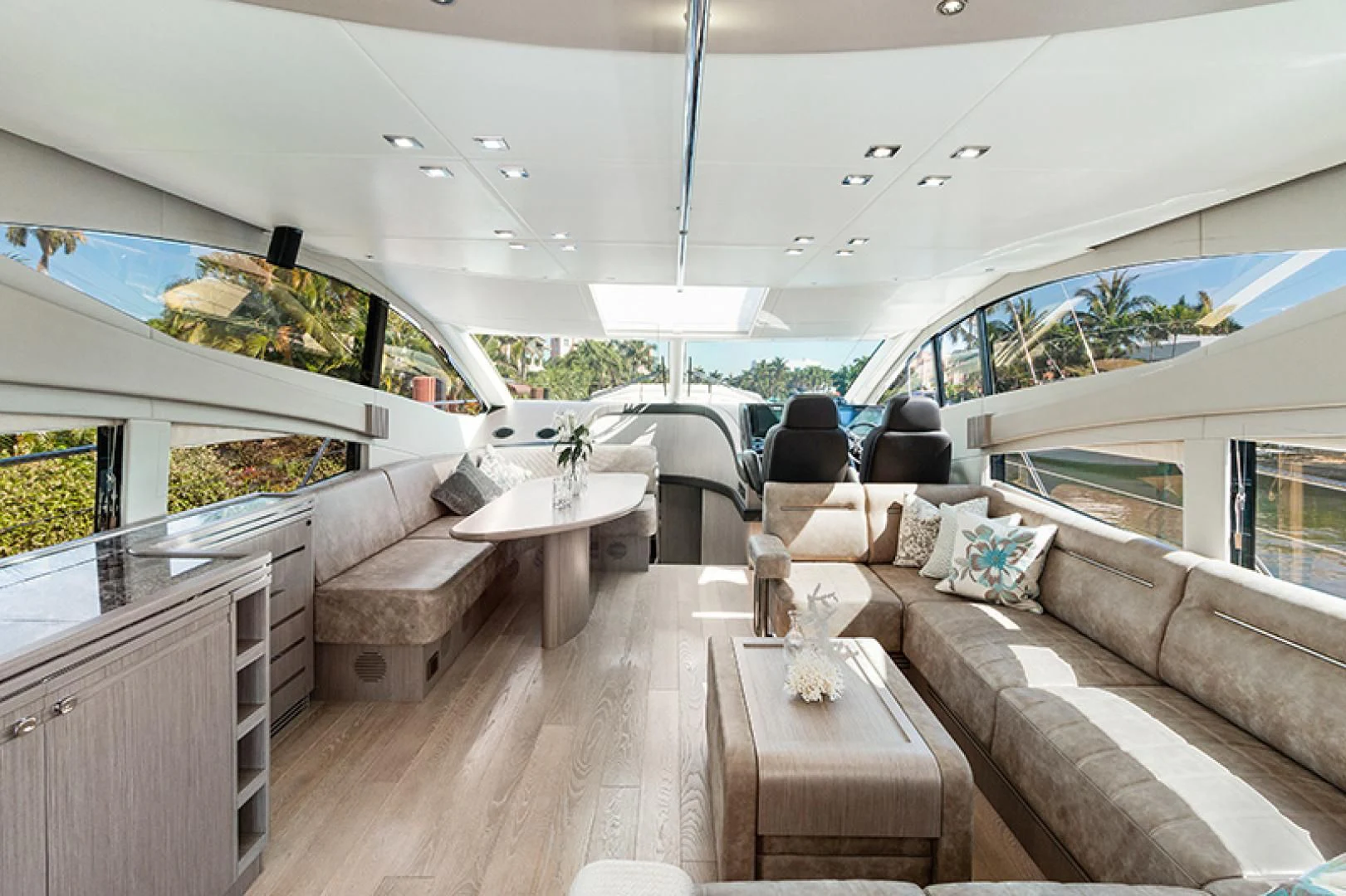 a living room with a couch and a table aboard LONG WAY ROUND Yacht for Sale