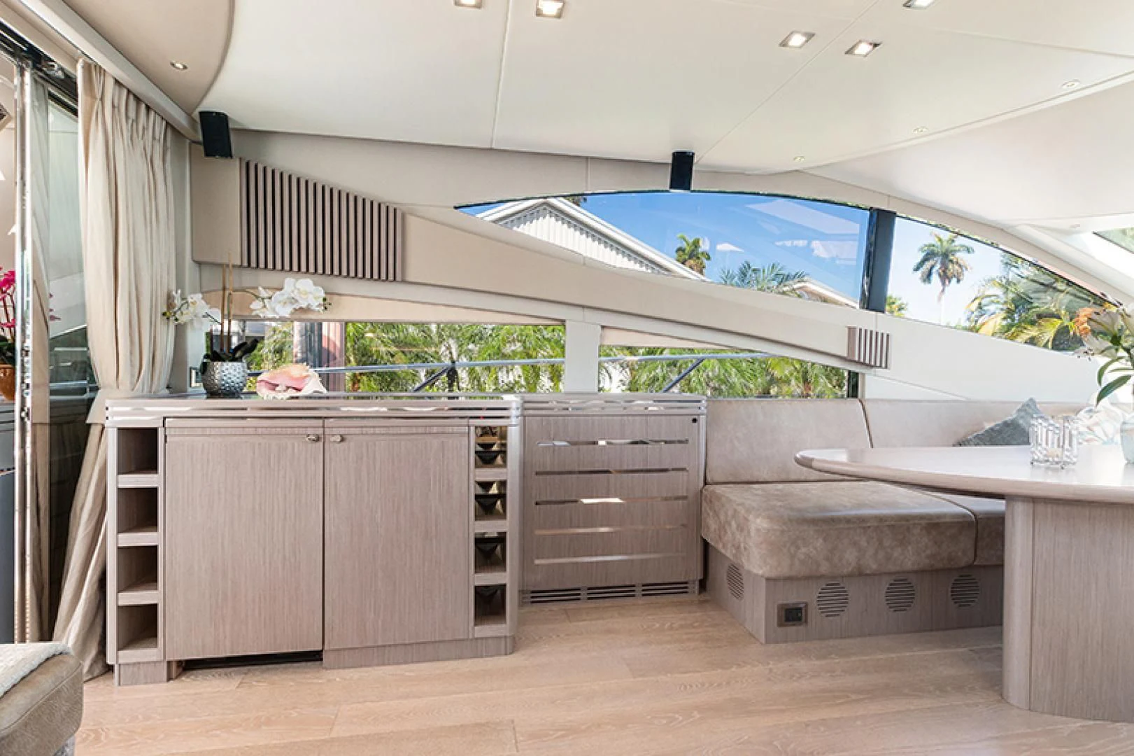 a room with a table and a couch aboard LONG WAY ROUND Yacht for Sale