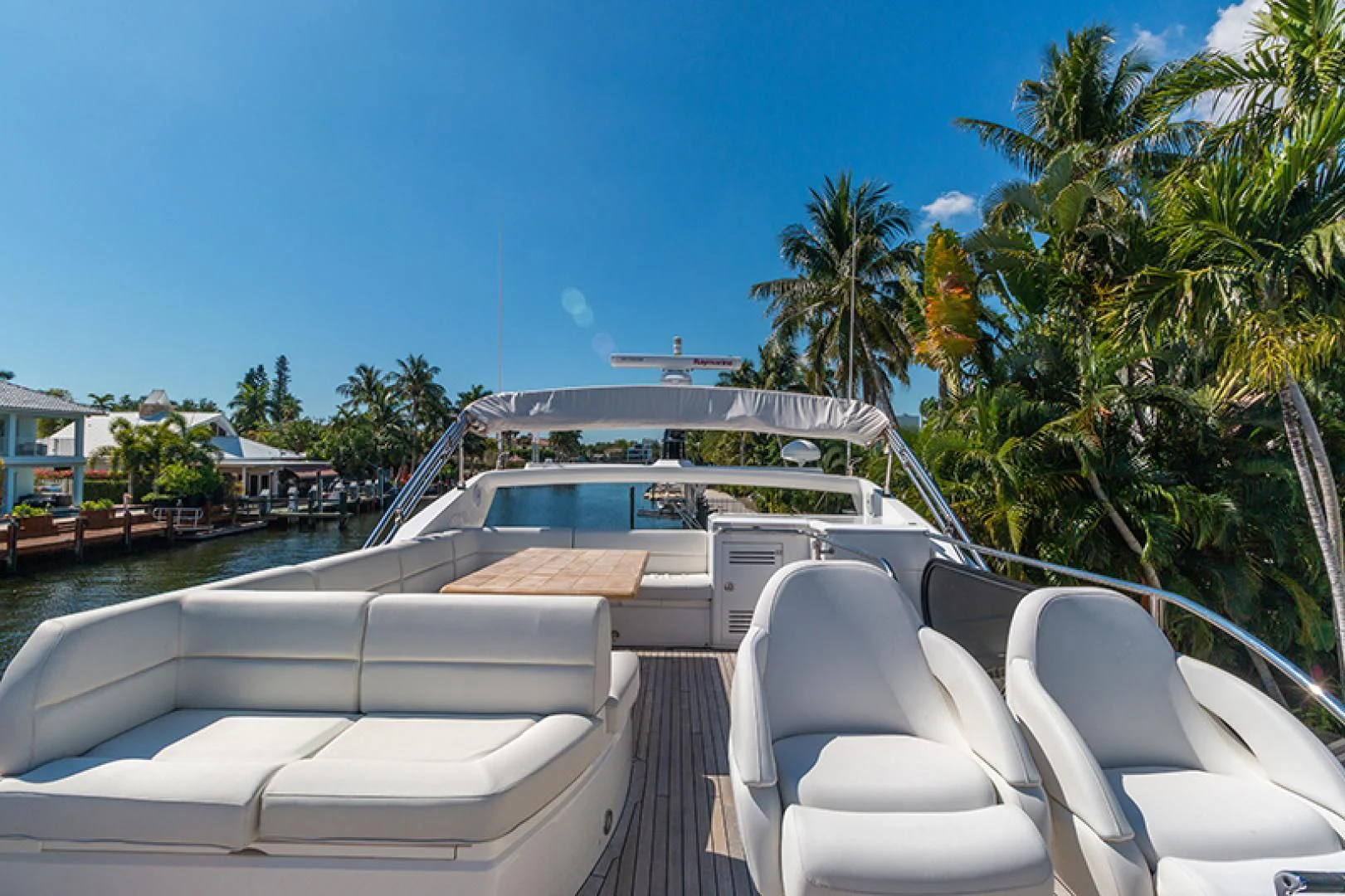 a deck with chairs and a pool aboard LONG WAY ROUND Yacht for Sale