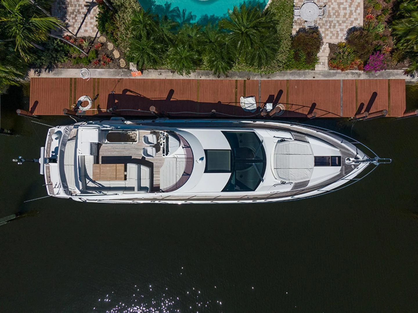 a white car with a black and gold design on it aboard LONG WAY ROUND Yacht for Sale