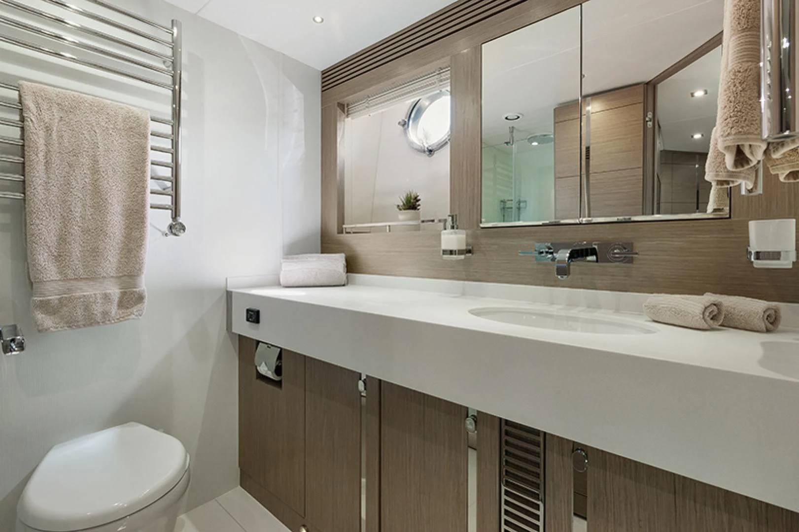 a bathroom with a large mirror aboard LONG WAY ROUND Yacht for Sale