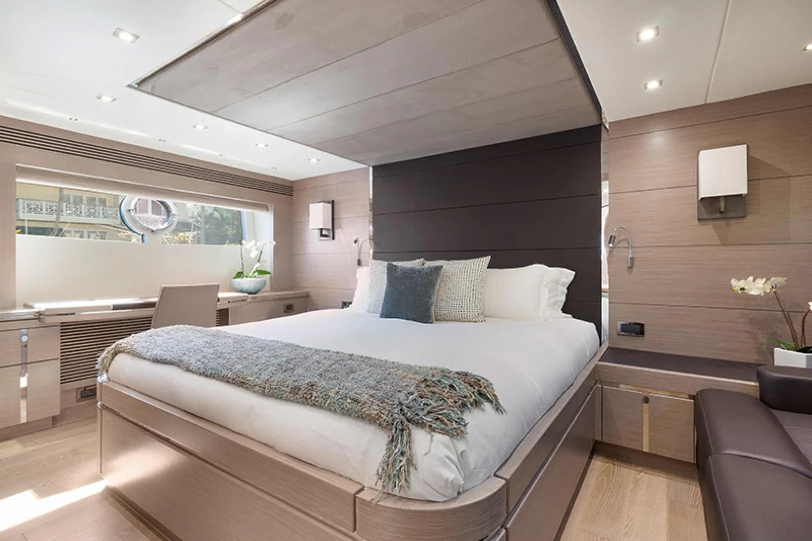 a large bed in a room aboard LONG WAY ROUND Yacht for Sale