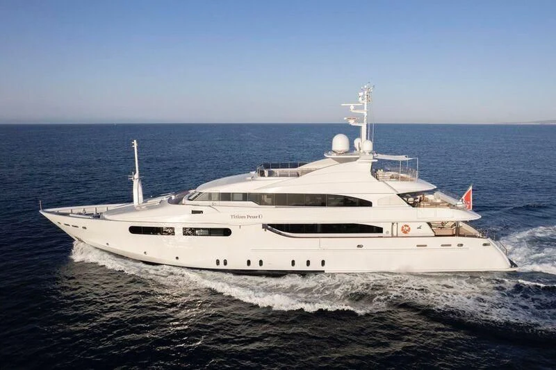 a white yacht on the water aboard TITIAN PEARL Yacht for Sale