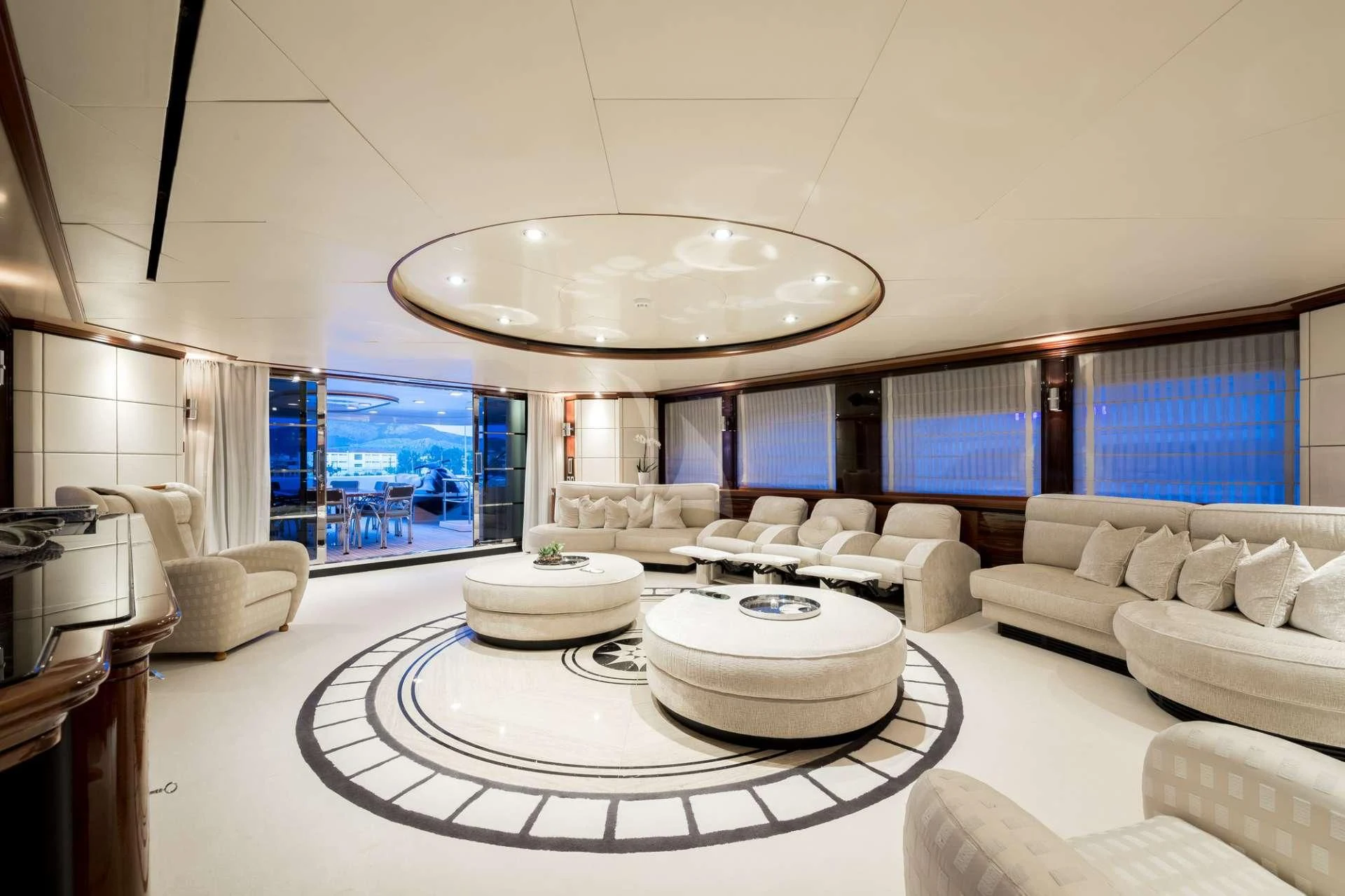 a large white room with a large chandelier aboard TITIAN PEARL Yacht for Sale